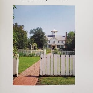 Historic house with white picket fence.